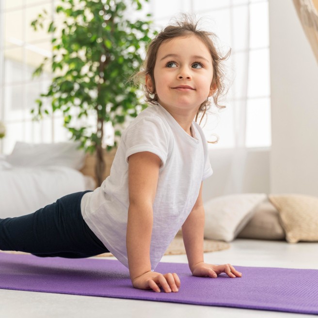 Toddler stretching during a foundation gymnastics class
